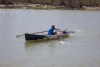 Daniel O'Callaghan rowing along River Murray