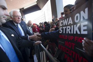 Democratic presidential candidate, Sen. Bernie Sanders, I-Vt., greets a CWA worker at a Verizon workers picket line, Wednesday, April 13, 2016, in the Brooklyn borough of New York.