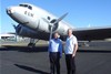 Howard Hinde and Associate Professor Dirk Spennemann from Charles Sturt University in front of the DC2 at Albury Airport.