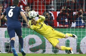 Atletico goalkeeper Jan Oblak saves a Thomas Mueller penalty during the Champions League second leg semifinal soccer match between Bayern Munich and Atletico de Madrid