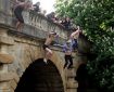 Oxford students jumping off of Magdalene Bridge