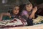 Syrian refugee children look out from their tent during the visit of the Dutch Prime Minister Mark Rutte to an informal Syrian refugee camp in the southern town of Zahrani, south of the port city of Sidon, Lebanon, Tuesday, May 3, 2016. (AP Photo/Mohammed Zaatari)