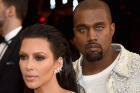 Kim Kardashian and Kanye West looking ahead in silver at the Manus x Machina: Fashion In An Age Of Technology Gala at ...