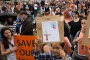 Protestors rally to save the trees on Anzac Parade in Moore Park that are scheduled to be destroyed to make way for the ...