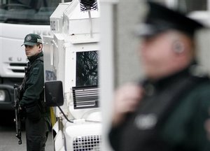 Police Service of Northern Ireland officers outside Lisburn Court, Northern Ireland, Tuesday March, 24, 2009. A Northern Ireland teen-ager charged with the dissident IRA killing of a policeman had an assault rifle and 26 rounds of ammo — and refused to say a word to his interrogators during 13 days of questioning, a detective testified Tuesday at the defendant's first court appearance. He was arrested March 10 in a working-class Catholic district of Craigavon a day after a policeman, 48-year-old Stephen Carroll, was shot fatally through the back of the head after responding to an emergency call in the religiously divided town. He was the first policeman killed in Northern Ireland since 1998, the year of the landmark peace accord between the territory's British Protestant majority and Irish Catholic minority.