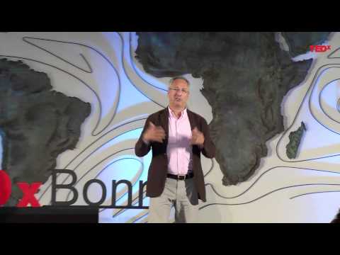 The role of remittances in a broader development context | Leon Isaacs | TEDxBonn