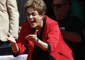 Brazil's President Dilma Rousseff blows kisses towards supporters during the May Day rally in Sao Paulo, Brazil, Sunday, May 1, 2016.