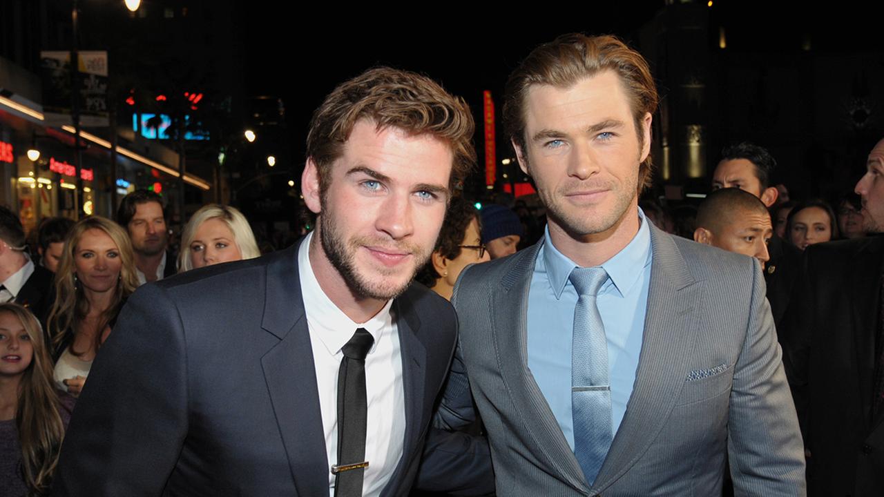 Liam Hemsworth, left, and Chris Hemsworth arrive at the U.S. premiere of Thor: The Dark World at the El Capitan Theatre on Monday, Nov. 4, 2013, in Los Angeles.