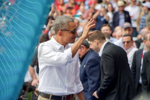 President Obama waves to the crowd at the Estadio Latinoamericano in Havana, Cuba