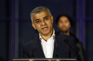 Sadiq Khan, Labour Party candidate, speaks on the podium after hearing the results of the London mayoral elections, at City Hall in London, Saturday, May 7, 2016. (AP Photo/Kirsty Wigglesworth)