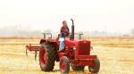 Sultan's leading lady Anushka Sharma rides a tractor in Punjab