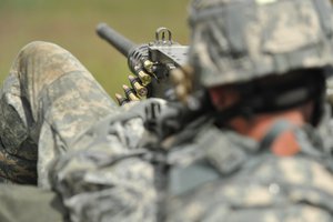 U.S. Army Staff Sgt. Clinton Milroy of the U.S. Army NATO Brigade fires an M2 .50-caliber heavy machine gun during an event at  U.S. Army Europe Best Warrior Competition in Grafenwoehr, Germany.