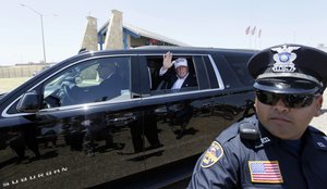 In this July 23, 2015 file photo, Republican presidential candidate Donald Trump waves from his vehicle during a tour of the the World Trade International Bridge along the U.S.-Mexico border in Laredo, Texas.