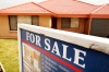 Police claim he took down the signs and moved right in - without paying for the house.