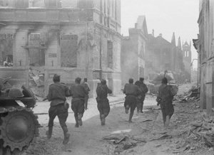 File - Soviet soldiers advance through the streets of Jelgava, Latvia, in the summer of 1944.