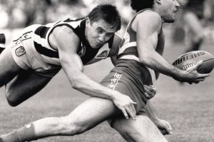 Collingwood's Tony Shaw makes a flying tackle on Footscray's Angelo Petraglia.