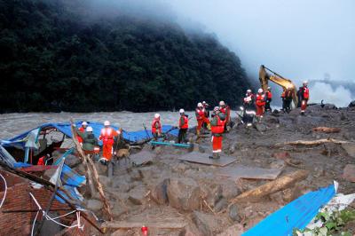 Paramilitary police searching for survivors at the accident site.