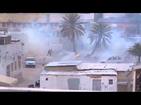 Bahraini regime mercenaries suppress people at the end of the funeral of the martyr  Al-Rayes