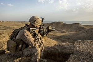 Marine Corps Sgt. Josh Greathouse scans the area during a perimeter patrol in Al Taqaddum, Iraq, March 21, 2016. Greathouse is a team leader assigned to Bravo Company, 1st Battalion, 7th Marine Regiment, Special Purpose Marine Air Ground Task Force Crisis Response for U.S. Central Command.