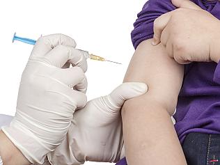 The doctor gave children vaccination needle