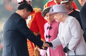 This is a Tuesday, Oct. 20, 2015 file photo of Britain's Queen Elizabeth II , right, as she greets Chinese President Xi Jinping, during the official ceremonial welcome for the Chinese State Visit, in London.