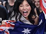 Australia's Dami Im, center, celebrates when learning that she advanced to the final during the second Eurovision Song Contest semifinal in Stockholm, Sweden, Thursday, May 12, 2016. (AP Photo/Martin Meissner)