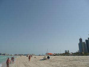 View towards Palm Jumeirah from a beach in the Dubai Marina area, Dubai, United Arab Emirates.