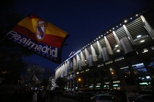 A Rail Madrid flag flies from a stall in front of Real Madrid's Santiago Bernabeu stadium in Madrid, Spain, Saturday, Nov. 21, 2015