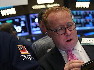 Stocks Drop Lower On Consumer Company Earnings