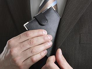 Man putting waller into pocket. suit, money, business shopping. File stock images. Picture: ThinkStock / Getty Images