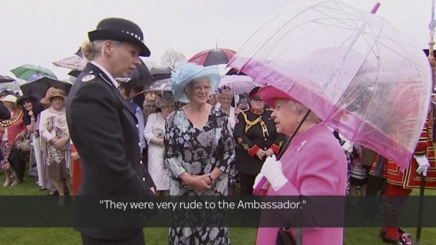 Queen Elizabeth II speaks with Metropolitan Police Commander Lucy D'Orsi in the garden of Buckingham Palace in London on ...