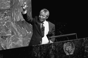 Nelson Mandela, Deputy President of the African National Congress of South Africa, raises his fist in the air while addressing the Special Committee Against Apartheid in the General Assembly Hall, 22 June, 1990.