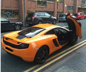 File - West Midlands Police is appealing for information after a large amount of cash was stolen from an orange McLaren supercar in Birmingham, England, 22 April, 2016.