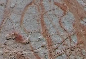 This enhanced-color view from NASA's Galileo spacecraft shows an intricate pattern of linear fractures on the icy surface of Jupiter's moon Europa.