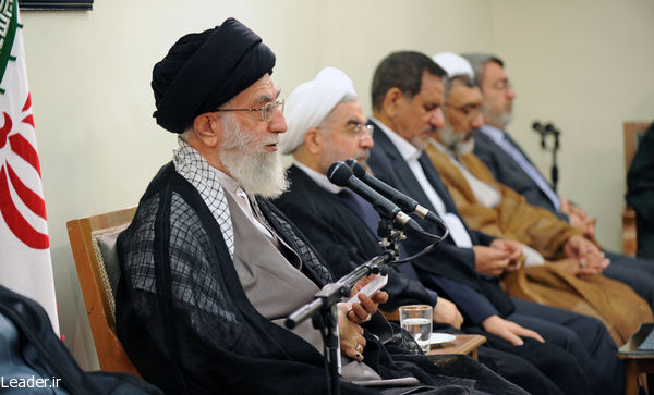 Iran's Supreme Leader Ali Khamenei sitting next to President Hassan Rouhani and addressing the cabinet.