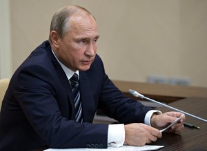 Russian President Vladimir Putin holds a meeting with senior government officials at the Novo-Ogaryovo residence outside Moscow, Russia on Wednesday, Sept. 30, 2015.