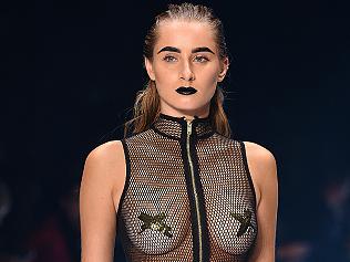 A model walks the runway during the We Are Handsome show at Mercedes-Benz Fashion Week Australia in Sydney, Thursday, May 19, 2016. (AAP Image/Dan Himbrechts) NO ARCHIVING, EDITORIAL USE ONLY