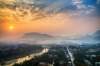 A world away: Sunrise at Luang Prabang.