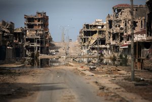 In this Saturday, Oct. 22, 2011 file photo, a general view of buildings ravaged by fighting in Sirte, Libya.