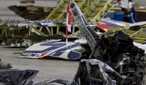 File - Parts of the wreckage of the Malaysia Airlines Flight 17 are displayed in a hangar at Gilze-Rijen airbase, Netherlands, Tuesday, March 3, 2015.