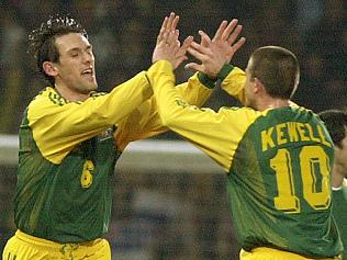 12/02/2003. Australia's Tony Popovic, left celebrates scoring a goal against England, with teammate Harry Kewell, during the friendly International soccer match at Upton Park stadium in London. (AP Photo/Richard Lewis)