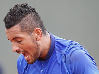 Australia's Nick Kyrgios screams after missing a return in the first round of the French Open tennis tournament against Italy’s Marco Checchinato at Roland Garros stadium in Paris, France, Sunday, May 22, 2016. (AP Photo/Christophe Ena)