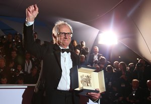 Director Ken Loach poses for photographers with the Palme d'Or for his film I, Daniel Blake during the photo call following the awards ceremony at the 69th international film festival, Cannes