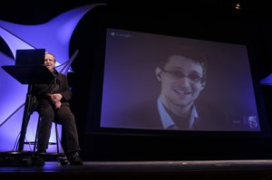 File - Former NSA contractor Edward Snowden participates in a conversation via video with John Perry Barlow, co-founder & vice chairman of the Electronic Frontier Foundation, at the 2014 Personal Democracy Forum, at New York University, Thursday, June 5, 2014 in New York.