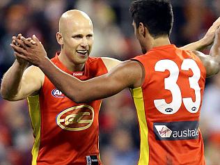 SPORT. BSM. 11/8/12. Aaron Hall of the Suns celebrates a goal with Gary Ablett during the AFL match between the Gold Coast Suns and the GWS Giants played at the Gold Coast. Pic Darren England.
