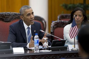 U.S. President Barack Obama, joined by National Security Adviser Susan Rice, right, speaks as he meets with Vietnamese Prime Minister Nguyen Xuan Phuc in the Presidential Palace Compound in Hanoi, Vietnam, Monday, May 23, 2016. (AP Photo/Carolyn Kaster)