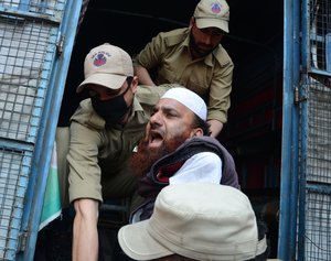 File - Police detain physically challenged persons inside a police vehicle during a protest in Srinagar on Tuesday 10, May 2016.