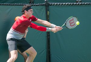 Milos Raonic (CAN) competes against Denis Kudla (USA) at the 2016 Miami Open presented by Itau in Key Biscayne, Florida. Photographer Aaron Gilbert