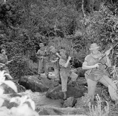 File - A British Army patrol crossing a stream during the Mau Mau rebellion. The Mau Mau rebellion was a military conflict that took place in British Kenya between 1952 and 1960.