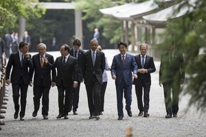 European Council Donald Tusk and British Prime Minister David Cameron walk together as they visit Ise Grand Shrine in Ise, Mie prefecture, Japan, May 26, 2016, ahead of the first session of the G7 summit meetings.